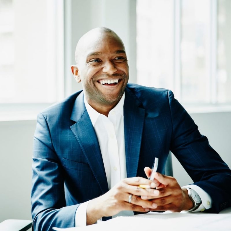 Wealth man sitting in office copy